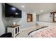 This airy bedroom showcases a large TV, accent wall, and bright, natural light at 549 Atwood Sw St, Atlanta, GA 30310