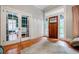 Bright foyer features hardwood floors, front door with sidelights, and access to other rooms at 549 Atwood Sw St, Atlanta, GA 30310