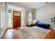 Inviting foyer with hardwood floors, a stylish rug, and natural light, perfect for greetings at 549 Atwood Sw St, Atlanta, GA 30310