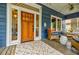 Welcoming porch with ample seating, a wooden front door, and stylish décor for relaxation at 549 Atwood Sw St, Atlanta, GA 30310