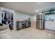 Comfortable living room with a view to a closet, kitchenette, and a brick accent wall at 549 Atwood Sw St, Atlanta, GA 30310
