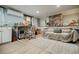 Versatile living room space with brick wall, modern desk, and comfortable seating area at 549 Atwood Sw St, Atlanta, GA 30310