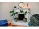 Charming fireplace with mantel, featuring elegant tiling, plants, and cozy decor in the living room at 549 Atwood Sw St, Atlanta, GA 30310