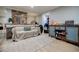Cozy living room featuring a painted brick wall, decorative furniture, and a view into the closet at 549 Atwood Sw St, Atlanta, GA 30310