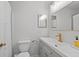 Bright bathroom with a large vanity, mirror, neutral paint, and brushed brass accents at 2110 Argyle Se Dr, Smyrna, GA 30080
