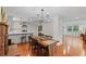 Inviting dining room with hardwood floors, a fireplace, and an open view to the kitchen at 2110 Argyle Se Dr, Smyrna, GA 30080