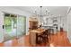 Elegant dining area with hardwood floors, stylish lighting, and access to an outdoor patio at 2110 Argyle Se Dr, Smyrna, GA 30080