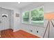 Bright entryway with hardwood floors and a view of the outdoors through large windows at 2110 Argyle Se Dr, Smyrna, GA 30080