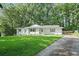 Charming one-story home with a well-manicured lawn and mature trees at 2110 Argyle Se Dr, Smyrna, GA 30080