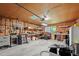 Spacious garage interior with pegboard wall, overhead lighting, and storage shelving at 2110 Argyle Se Dr, Smyrna, GA 30080
