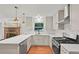 Well-equipped kitchen with white marble countertops, stainless steel range, and recessed lighting at 2110 Argyle Se Dr, Smyrna, GA 30080