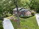 Aerial view of a beautiful brick home with a well-manicured lawn and a private driveway at 2719 Cravey Ne Dr, Atlanta, GA 30345