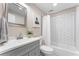 A bright bathroom with white subway tile, gray vanity, and modern fixtures at 2719 Cravey Ne Dr, Atlanta, GA 30345