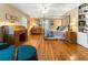 Bright bedroom featuring hardwood floors, a four-poster bed, and built-in bookshelves at 2719 Cravey Ne Dr, Atlanta, GA 30345