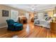 Spacious bedroom with hardwood floors, shuttered windows, and a comfortable sitting area at 2719 Cravey Ne Dr, Atlanta, GA 30345