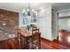 Cozy breakfast nook with a brick wall, wood table, and built-in cabinets with wine storage at 2719 Cravey Ne Dr, Atlanta, GA 30345