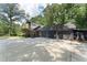 A spacious driveway and attached garage with lush landscaping at 2719 Cravey Ne Dr, Atlanta, GA 30345