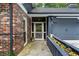 Charming home exterior with brick accents, a welcoming entrance, and a well-maintained landscape at 2719 Cravey Ne Dr, Atlanta, GA 30345