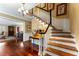 Inviting foyer with hardwood floors, elegant staircase, and chandelier lighting at 2719 Cravey Ne Dr, Atlanta, GA 30345