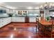 Bright kitchen with white cabinets, stainless steel appliances, hardwood floors, and a window over the sink at 2719 Cravey Ne Dr, Atlanta, GA 30345