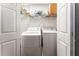 Functional laundry room with washer and dryer, and overhead shelving at 2719 Cravey Ne Dr, Atlanta, GA 30345