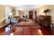 Classic living room featuring hardwood floors, a piano, and a comfortable seating area at 2719 Cravey Ne Dr, Atlanta, GA 30345