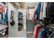 Well-organized walk-in closet with ample shelving and hanging space for clothes and accessories at 2719 Cravey Ne Dr, Atlanta, GA 30345