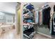 Functional walk-in closet with extensive storage solutions and easy access to the bathroom at 2719 Cravey Ne Dr, Atlanta, GA 30345