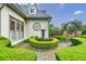 Well-manicured backyard with a stone fountain and lush greenery at 5318 Brooke Farm Dr, Dunwoody, GA 30338