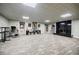 Open basement featuring a fireplace, light gray carpet, and recessed ceiling lights at 5318 Brooke Farm Dr, Dunwoody, GA 30338