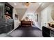Bedroom with plush carpet, built-in shelving, and natural light at 5318 Brooke Farm Dr, Dunwoody, GA 30338