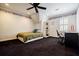 Bedroom featuring dark carpet, a ceiling fan, neutral walls, and a window providing natural light at 5318 Brooke Farm Dr, Dunwoody, GA 30338