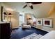 Bedroom featuring a cozy chaise lounge, artwork, and a window seat with natural light at 5318 Brooke Farm Dr, Dunwoody, GA 30338