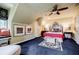 Bedroom featuring an ornate headboard, stylish lighting, and a window seat with natural light at 5318 Brooke Farm Dr, Dunwoody, GA 30338
