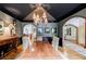 Elegant dining room featuring hardwood floors, designer lighting, and detailed trim at 5318 Brooke Farm Dr, Dunwoody, GA 30338