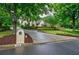 Beautiful home with a long driveway and mature trees at 5318 Brooke Farm Dr, Dunwoody, GA 30338