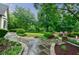 Beautiful walkway with lush greenery, leading to the home at 5318 Brooke Farm Dr, Dunwoody, GA 30338