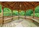 Interior of a beautiful gazebo with built in benches and a decorative ceiling at 5318 Brooke Farm Dr, Dunwoody, GA 30338