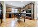 Well-equipped kitchen featuring dark cabinets, hardwood floors, and stainless steel appliances at 5318 Brooke Farm Dr, Dunwoody, GA 30338