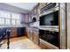 Traditional kitchen features custom wood cabinetry and stainless steel appliances at 5318 Brooke Farm Dr, Dunwoody, GA 30338
