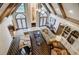Open-concept living room with fireplace, and bright windows at 5318 Brooke Farm Dr, Dunwoody, GA 30338