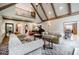 Cozy living room with vaulted ceilings, fireplace, and comfortable seating arrangements at 5318 Brooke Farm Dr, Dunwoody, GA 30338