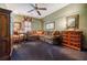 Spacious living room featuring a corner sofa, dark carpet, and a writing desk by a window at 5318 Brooke Farm Dr, Dunwoody, GA 30338