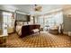Spacious main bedroom featuring neutral colors, hardwood floors and lots of natural light at 5318 Brooke Farm Dr, Dunwoody, GA 30338