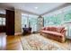 Bright sunroom filled with natural light and hardwood floors, perfect for relaxing at 5318 Brooke Farm Dr, Dunwoody, GA 30338