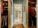 Spacious walk-in closet with wood shelving and rod system for optimal organization at 5318 Brooke Farm Dr, Dunwoody, GA 30338