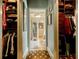 Well-organized walk-in closet with ample storage for clothing, handbags and accessories at 5318 Brooke Farm Dr, Dunwoody, GA 30338