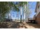 View of the home's yard and rear wooden deck, showing the space and outdoor potential at 6225 Pebble Dr, Douglasville, GA 30135