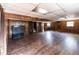Expansive finished basement features wood-paneled walls and durable dark laminate flooring at 6225 Pebble Dr, Douglasville, GA 30135