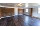 Renovated basement featuring stylish brick wall accents, durable laminate flooring, and ample natural light at 6225 Pebble Dr, Douglasville, GA 30135